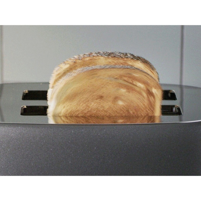 A picture of pair of toast sticking out of the toaster