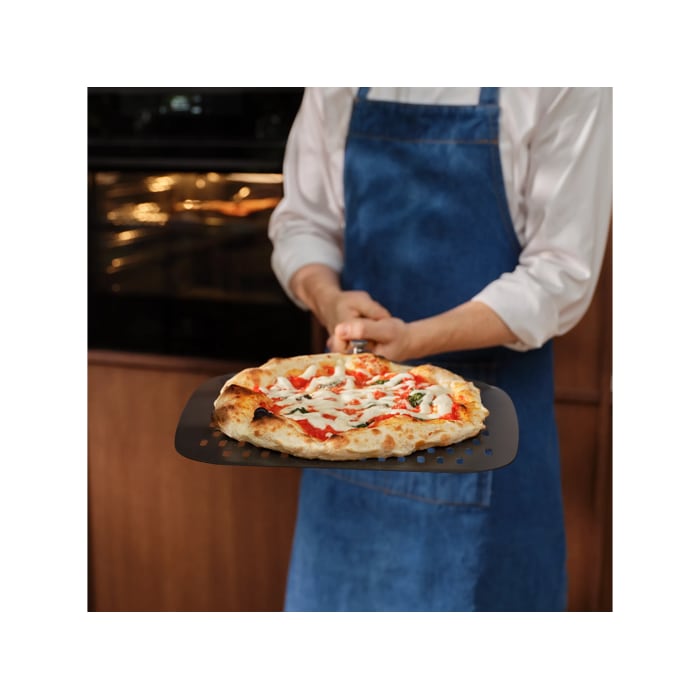Person holding the pizza expert pizza peel with a Neapolitan pizza