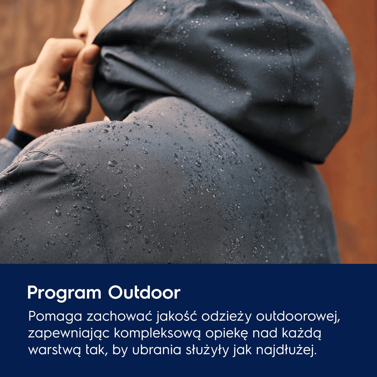 A photo of a waterproof hooded jacket with water droplets running down it